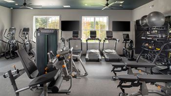 Fitness center with cardio equipment, fixed weight machines, free weights and stretching mats